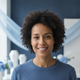 Close-up portrait of a content person with a genuine smile, looking at the viewer.